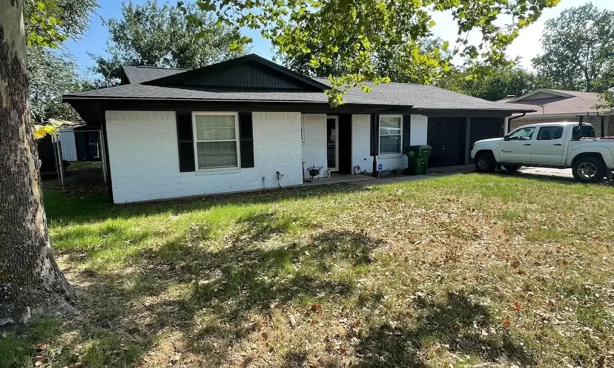 Professional roofing crew working on a residential roof in Trophy Club